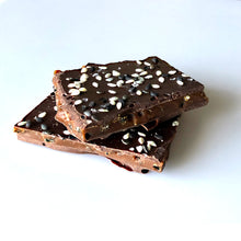 Load image into Gallery viewer, Close up of 2 stacked pieces of the sesame brittle candy.