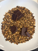 Load image into Gallery viewer, Gingerbread spices (ginger, cloves, cloves) on a white plate with 5 pieces of toffee brittle on top of the spices. 