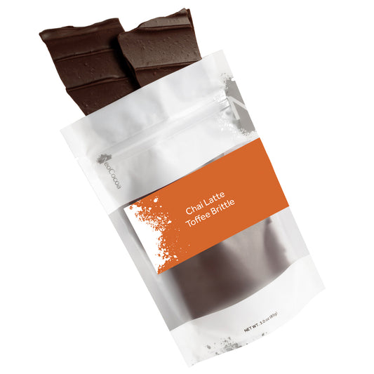 Chai Latte Toffee Brittle packaging with chocolate pieces on a white background