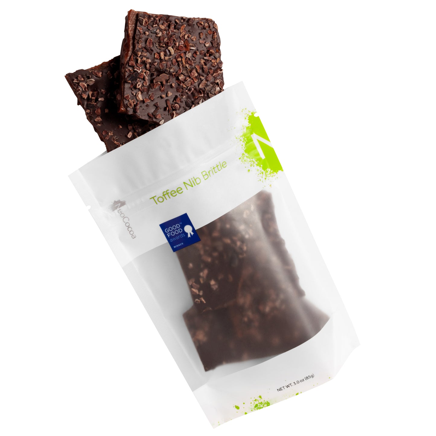 Toffee Nib Brittle pouring out of 3oz sized bag with label stating “Toffee Nib Brittle” and a light green NeoCocoa logo and a blue “Good Food Award” sticker on a white background.