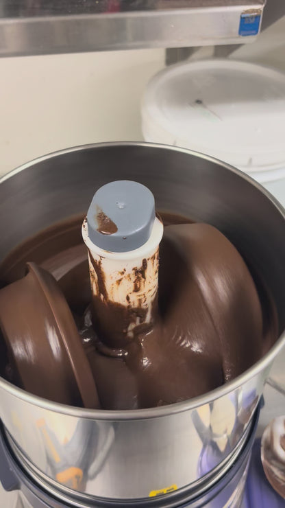 Ginding sesame toffee brittle in machine