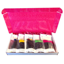 Load image into Gallery viewer, Open gift box lid open with 5 -3oz bags of brittle fanned out to fill the box. Crinkle paper cushions the bags in the box. 
