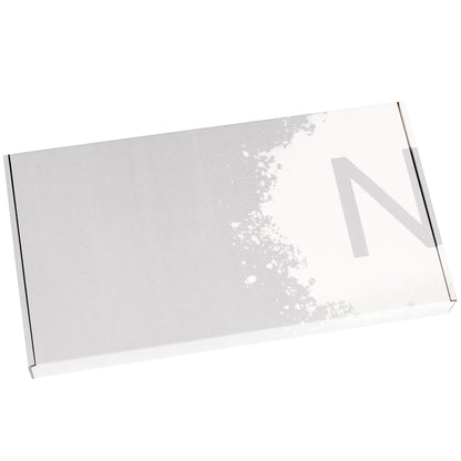 Closed silver colored rectangle brittle gift box showing NeoCocoa logo on lid in white.