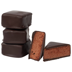 3 stacked, square dark chocolate covered chocolate marshmallows and 1 square piece cut in half to expose the chocolate marshmallow inside.